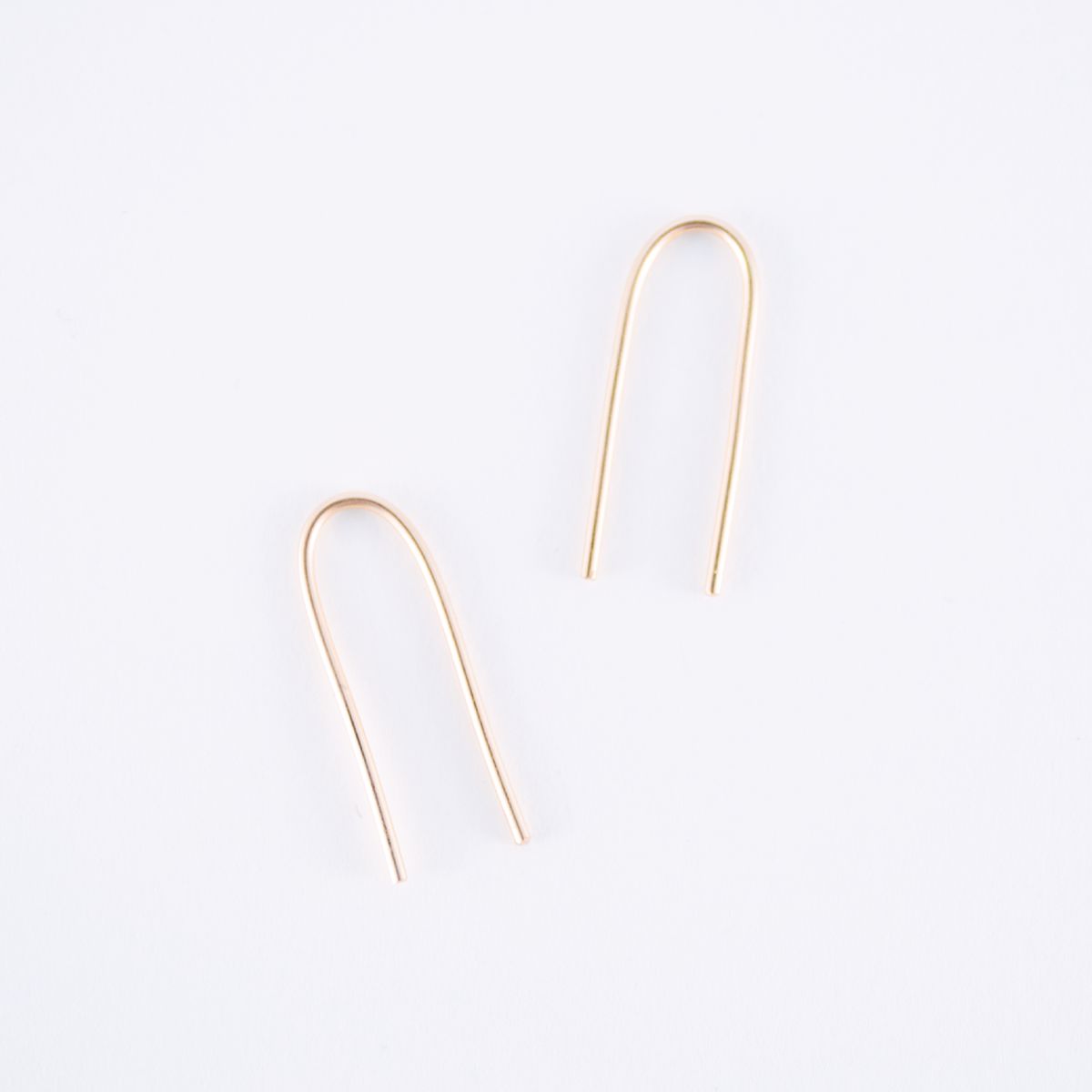 gold arc earrings
